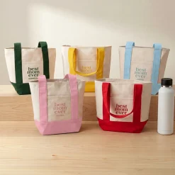 Best Mom Ever Mini Tote Bag .product-info-decoration { display: inline-flex; justify-content: space-between; align-items: center; border-radius: 0.4rem; background-color: #E8E8E8; padding: 0.2rem 0.4rem; font-size: 1.4rem; line-height: 1.6rem; font-weight: var(--font-weight-semibold); letter-spacing: 0.042rem; text-transform: uppercase; --decoration-icon-url: ''; /* will be dynamically set */}.product-info-decoration.badge-icon::before { content: ''; width: 2rem; height: 2rem; background: var(--decoration-icon-url) no-repeat; background-size: 100% 100%; display: block; margin-right: 0.4rem;} FULL-COLOR CUSTOMIZATION