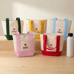 Heart & Name Mini Tote Bag .product-info-decoration { display: inline-flex; justify-content: space-between; align-items: center; border-radius: 0.4rem; background-color: #E8E8E8; padding: 0.2rem 0.4rem; font-size: 1.4rem; line-height: 1.6rem; font-weight: var(--font-weight-semibold); letter-spacing: 0.042rem; text-transform: uppercase; --decoration-icon-url: ''; /* will be dynamically set */}.product-info-decoration.badge-icon::before { content: ''; width: 2rem; height: 2rem; background: var(--decoration-icon-url) no-repeat; background-size: 100% 100%; display: block; margin-right: 0.4rem;} FULL-COLOR CUSTOMIZATION